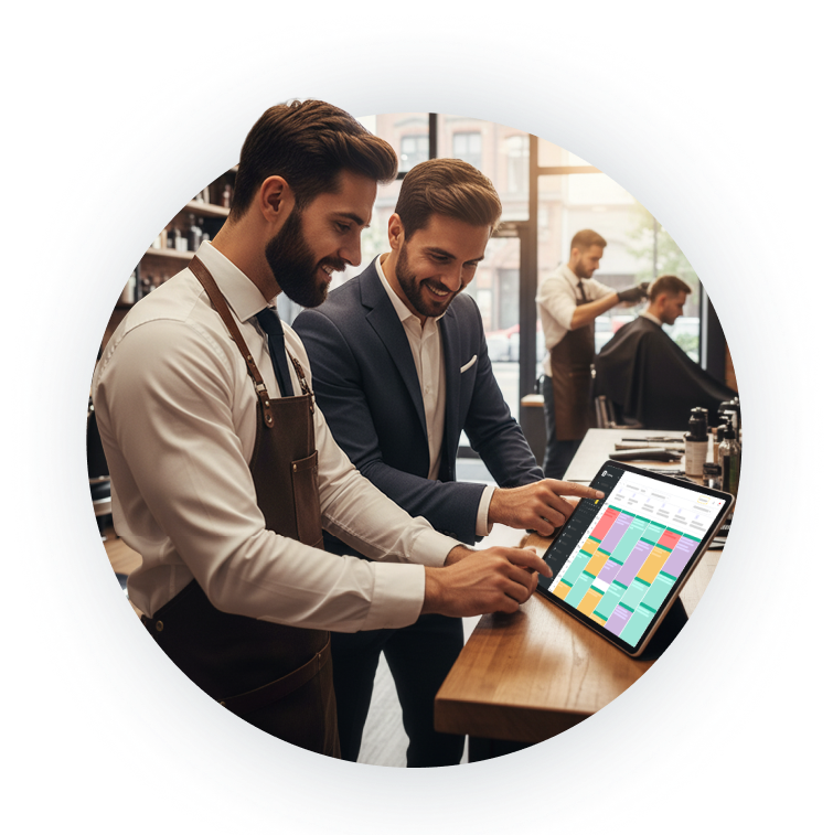 two men in business attire smile while looking at a tablet displaying a colorful calendar on a bar counter | altegio | altegio